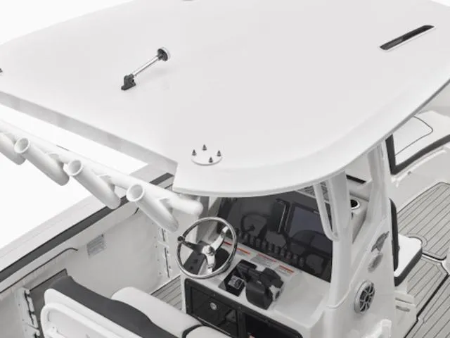 Slide: The Image of 2024 Yamaha Boats 252 FSH Sport helm station with T-top and rod holders. - 8