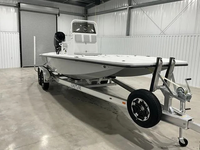 Slide: The Image of 2024 Freedom Boats 23' Warrior on trailer in storage facility. - 11