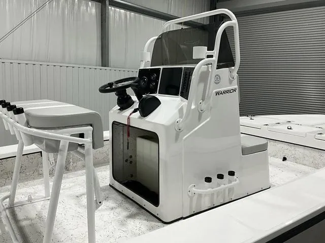Slide: The Image of 2024 Freedom Boats 23' Warrior center console in a showroom. - 4