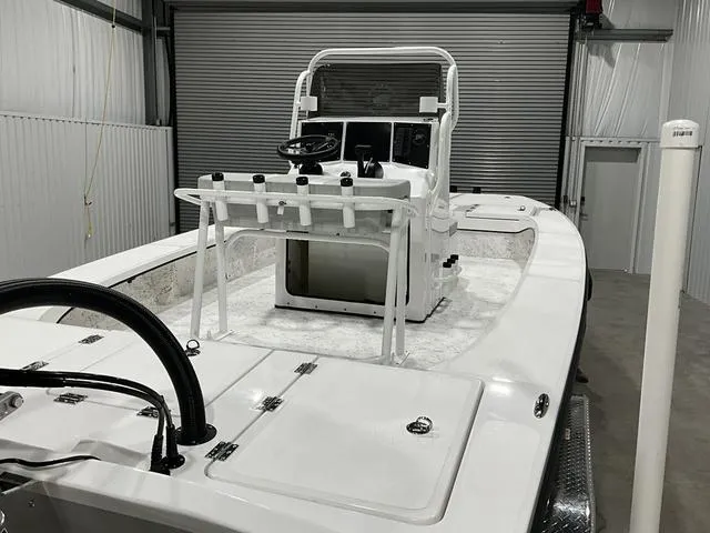 Slide: The Image of 2024 Freedom Boats 23' Warrior in a storage facility. - 5