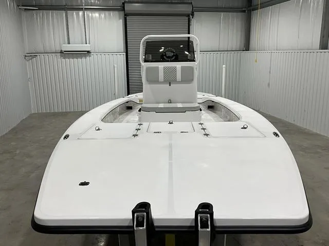 Slide: The Image of 2024 Freedom Boats 23' Warrior in storage unit, front view. - 7