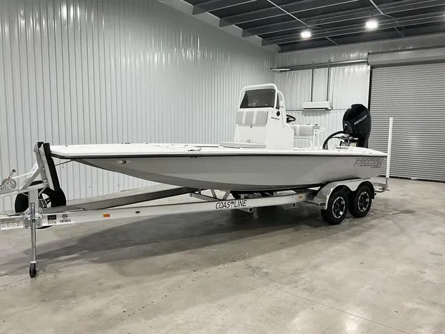 Slide: The Image of 2024 Freedom Boats 23' Warrior on trailer in indoor storage. - 9