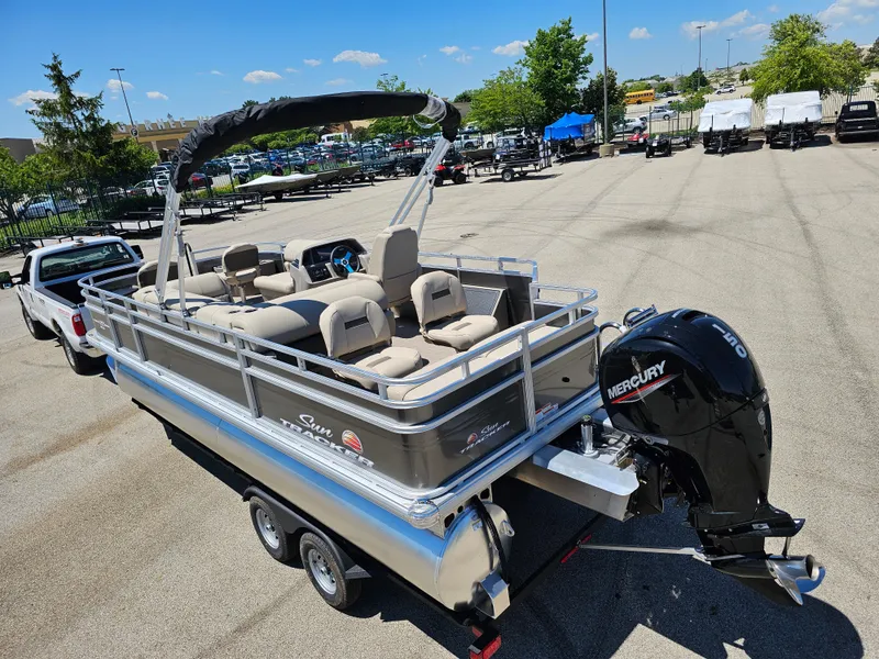 Slide: The Image of 2024 Sun Tracker Fishin' Barge 22 DLX pontoon boat with Mercury outboard motor. - 4