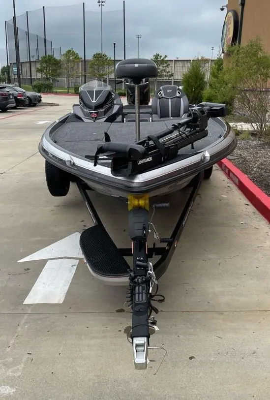 Slide: The Image of 2024 Ranger Z521R Ranger Cup Equipped boat on a trailer in a parking lot. - 1