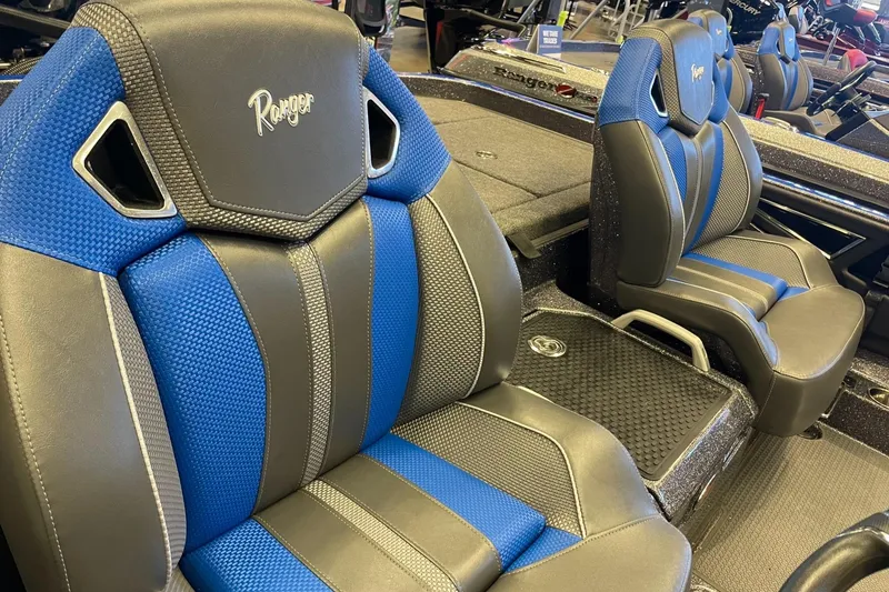 Slide: The Image of 2024 Ranger Z521R boat seats with blue and black upholstery, showcasing premium design. - 2