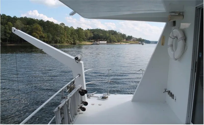 Slide: The Image of View from 1995 Pluckebaum Coastal Cruiser on a serene lake with lush greenery. - 10