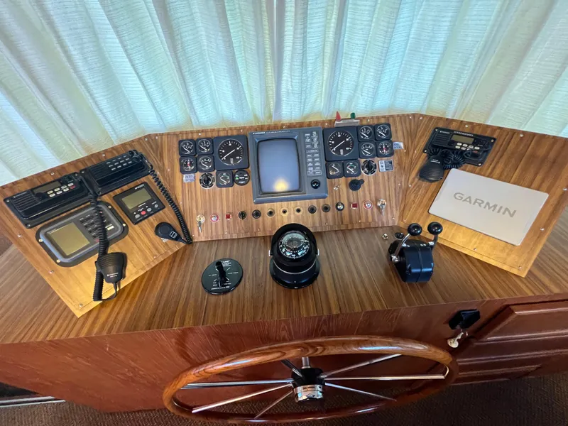 Slide: The Image of 1995 Pluckebaum Coastal Cruiser control panel with Garmin navigation system. - 16