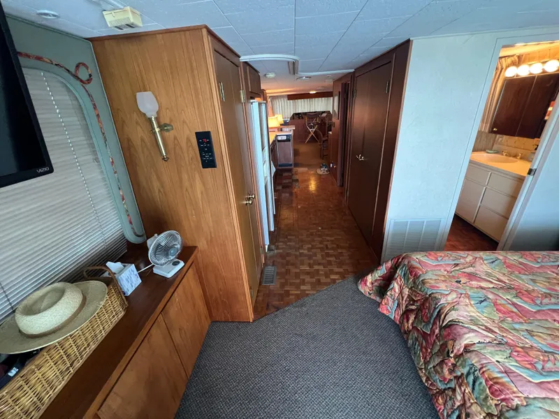 Slide: The Image of Interior of a 1995 Pluckebaum Coastal Cruiser with bedroom and bathroom. - 21
