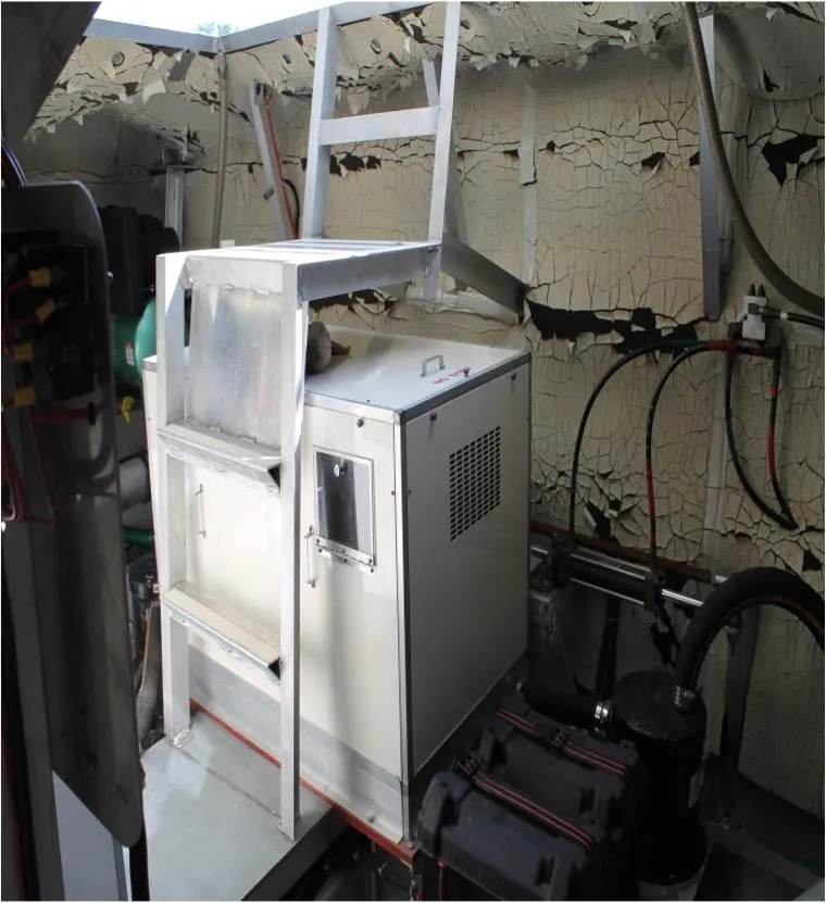 Slide: The Image of 1995 Pluckebaum Coastal Cruiser engine room with equipment and peeling paint. - 33