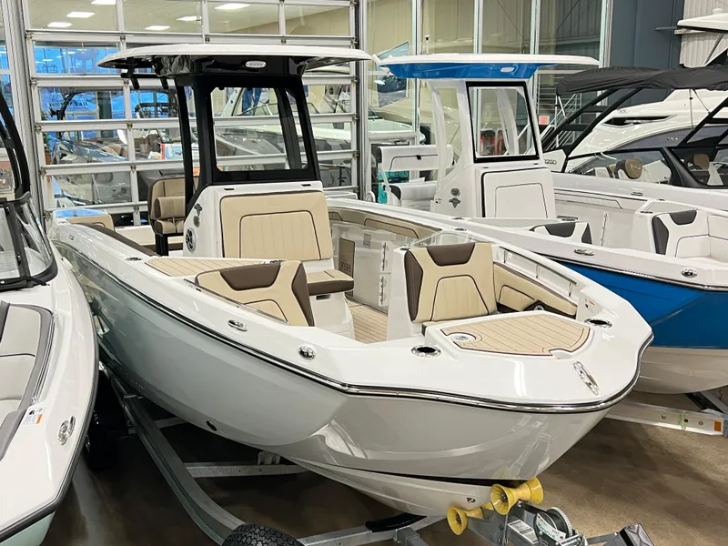 Slide: The Image of 2024 Yamaha Boats 255 FSH Sport H in showroom, front view. - 2
