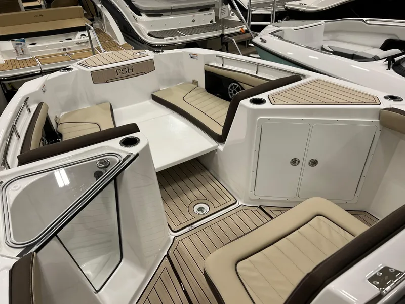 Slide: The Image of 2024 Yamaha Boats 255 FSH Sport H interior seating and storage compartments. - 6