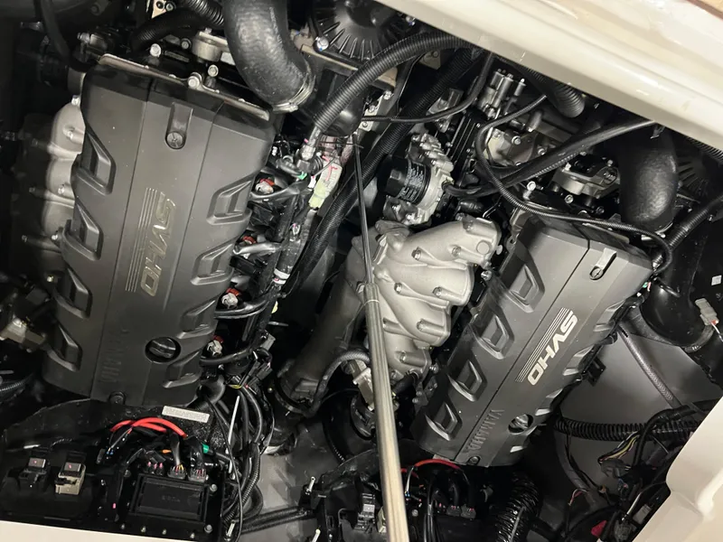 Slide: The Image of 2024 Yamaha Boats 255 FSH Sport H engine compartment with twin SVHO engines. - 8
