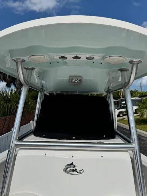 Slide: The Image of 2013 Sea Fox 286 CC center console boat with T-top and electronics. - 11