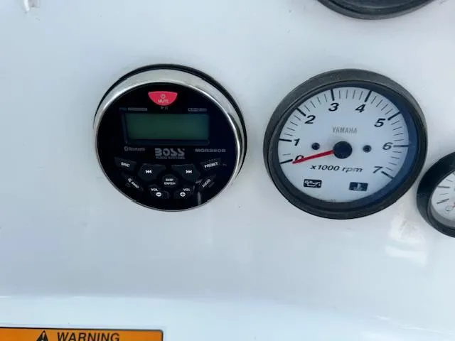 Slide: The Image of Close-up of 2013 Sea Fox 286 CC dashboard with Boss audio system and Yamaha tachometer. - 15