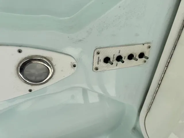 Slide: The Image of Control panel and light fixture on a 2013 Sea Fox 286 CC boat. - 18