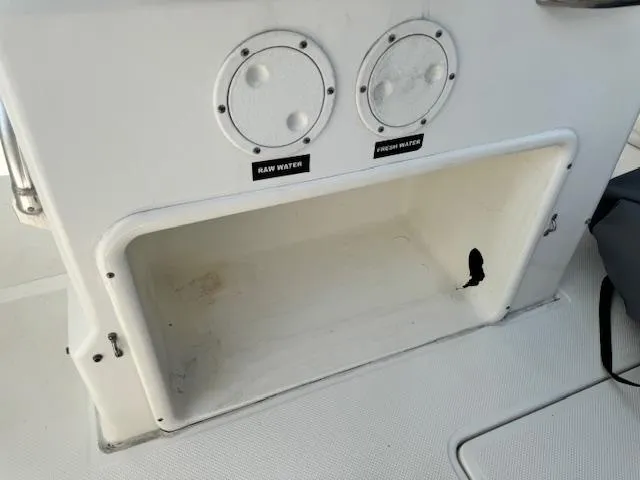 Slide: The Image of Storage compartment on a 2013 Sea Fox 286 CC boat with raw and fresh water access. - 19
