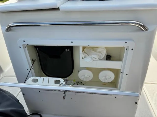 Slide: The Image of 2013 Sea Fox 286 CC boat storage compartment with open hatch. - 22