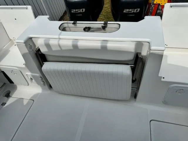 Slide: The Image of 2013 Sea Fox 286 CC boat with foldable bench seat and twin 250 horsepower engines. - 28
