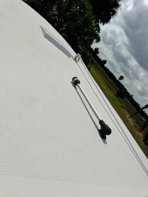 Slide: The Image of 2013 Sea Fox 286 CC boat deck with a rod holder. - 30