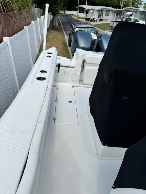 Slide: The Image of 2013 Sea Fox 286 CC boat deck with seating and rod holders. - 33