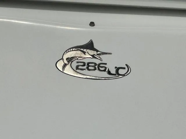 Slide: The Image of 2013 Sea Fox 286 CC logo with marlin graphic on boat hull. - 6