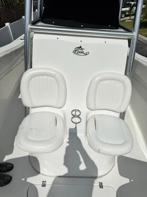 Slide: The Image of 2013 Sea Fox 286 CC boat with dual white cushioned seats. - 8