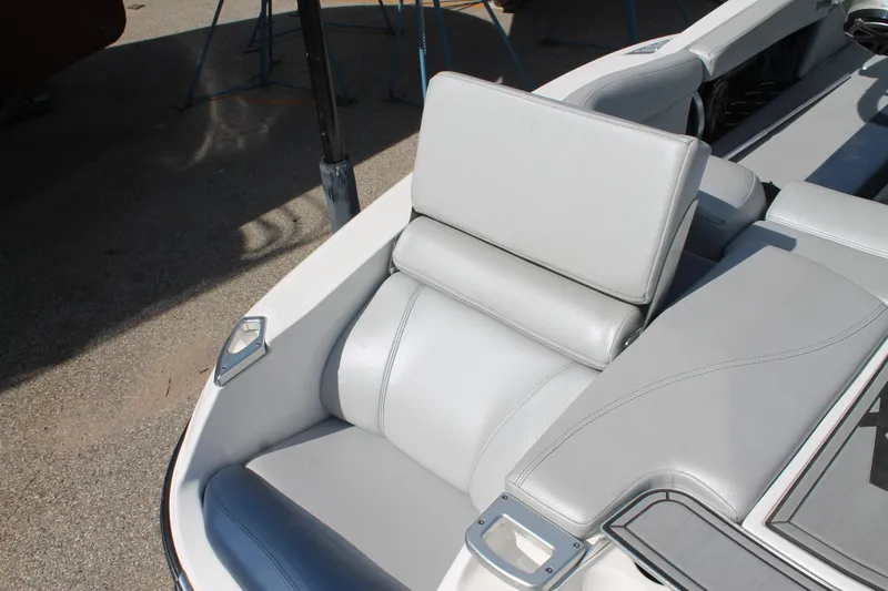 Slide: The Image of 2016 MasterCraft X26 boat with gray leather seating. - 13