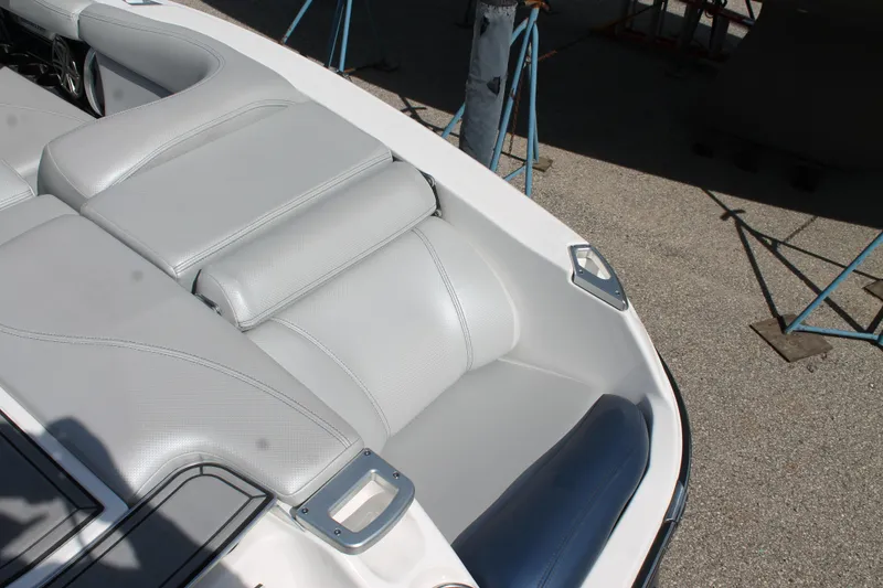 Slide: The Image of 2016 MasterCraft X26 boat interior with gray leather seating. - 14