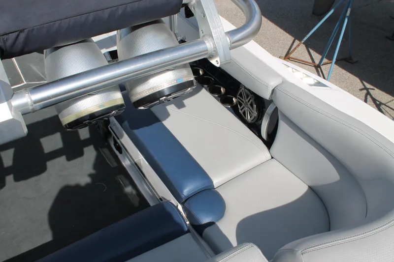 Slide: The Image of 2016 MasterCraft X26 boat interior with gray and blue seating. - 20