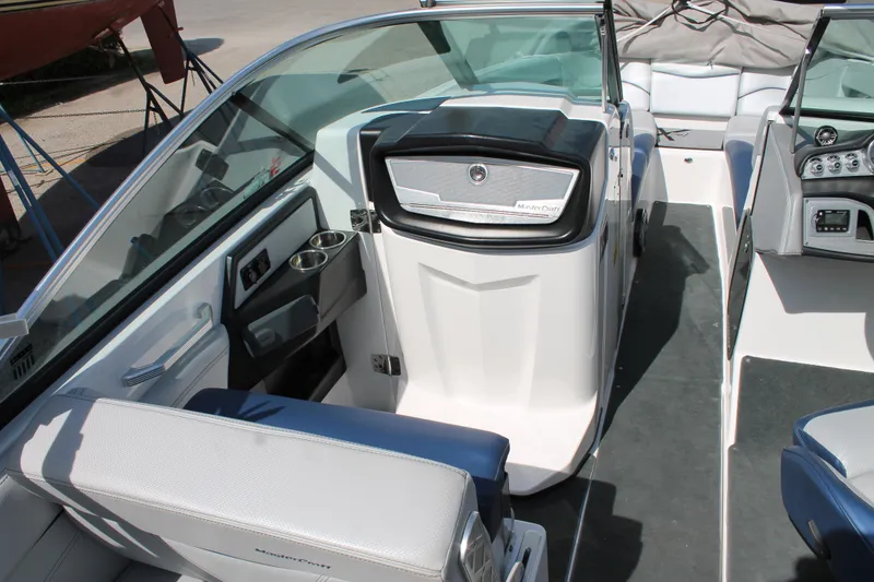 Slide: The Image of 2016 MasterCraft X26 boat interior with seating and dashboard. - 22