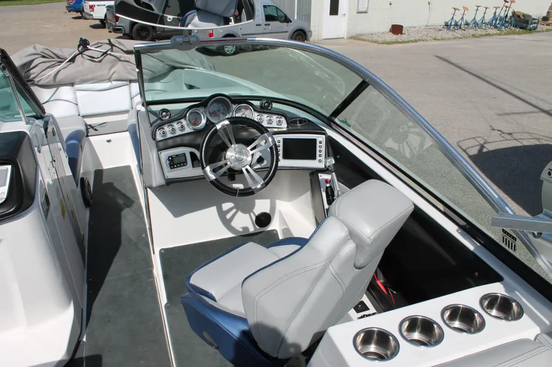 Slide: The Image of 2016 MasterCraft X26 boat cockpit with steering wheel and dashboard. - 25