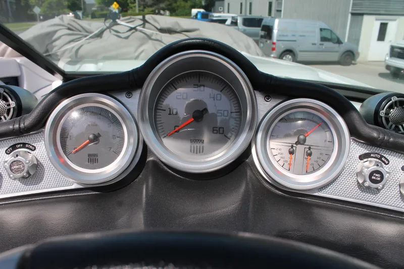 Slide: The Image of 2016 MasterCraft X26 boat dashboard with speedometer, tachometer, and fuel gauges. - 28