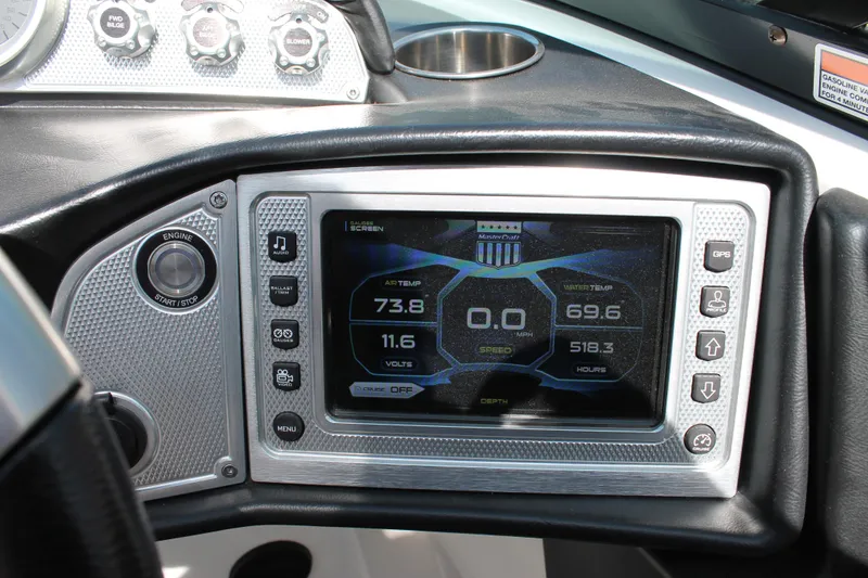 Slide: The Image of 2016 MasterCraft X26 boat dashboard with digital display and control buttons. - 29
