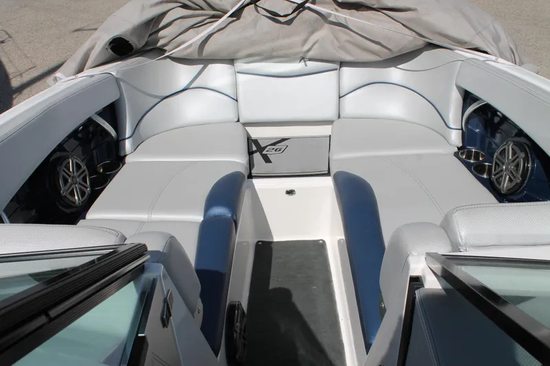 Slide: The Image of 2016 MasterCraft X26 boat interior with gray and blue seating. - 33
