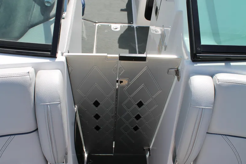 Slide: The Image of 2016 MasterCraft X26 boat interior with stylish door and seating. - 34