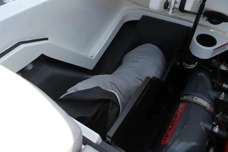 Slide: The Image of 2016 MasterCraft X26 boat storage compartment and engine. - 39