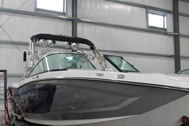Slide: The Image of 2016 MasterCraft X26 boat in a storage facility, showcasing sleek design and modern features. - 4