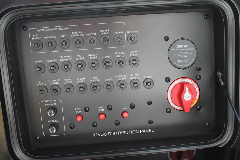 Slide: The Image of 2016 MasterCraft X26 12VDC distribution panel with switches and digital display. - 41