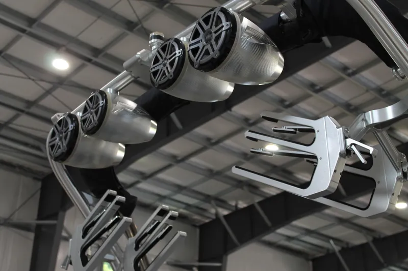 Slide: The Image of 2016 MasterCraft X26 boat speakers and wakeboard racks in a modern facility. - 9