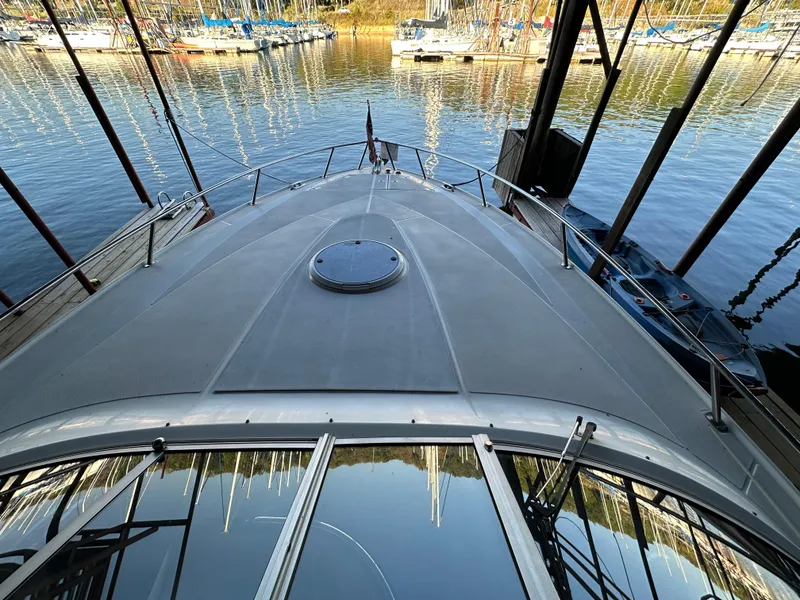 Slide: The Image of 2005 Regal 3350 Sport Cruiser docked at marina, view from bow. - 25