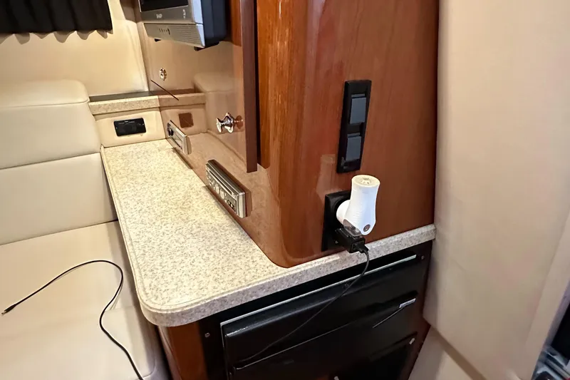 Slide: The Image of Interior cabin of a 2005 Regal 3350 Sport Cruiser with countertop and electrical outlets. - 33