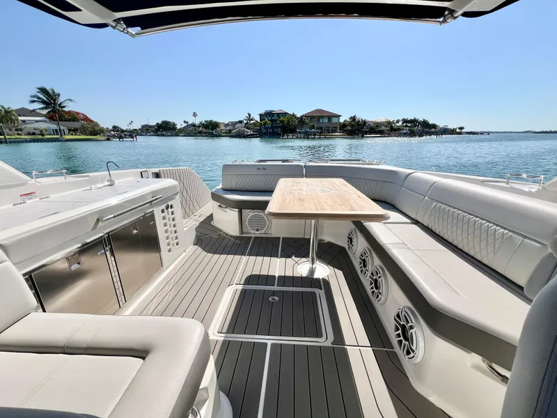 Slide: The Image of 2022 Sea Ray SLX 400 OB luxury boat interior with waterfront view. - 10