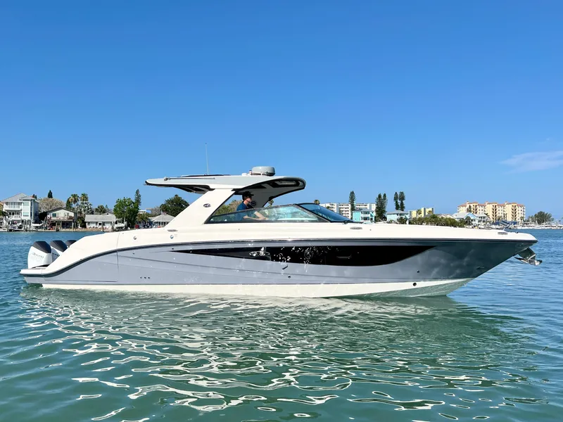 Slide: The Image of 2022 Sea Ray SLX 400 OB luxury boat on calm water. - 2