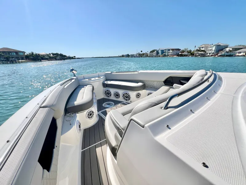 Slide: The Image of 2022 Sea Ray SLX 400 OB boat interior with waterfront view. - 24