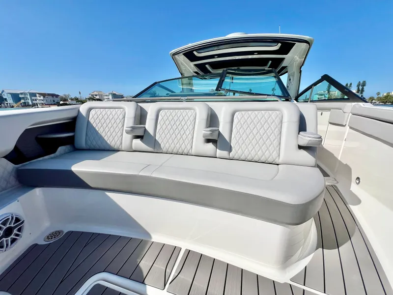 Slide: The Image of 2022 Sea Ray SLX 400 OB boat interior with luxurious seating. - 26