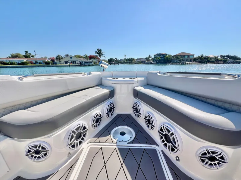 Slide: The Image of 2022 Sea Ray SLX 400 OB boat interior with waterfront view. - 28