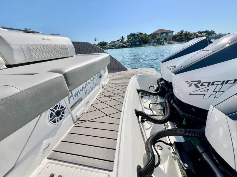Slide: The Image of 2022 Sea Ray SLX 400 OB boat with powerful outboard engines on a sunny day. - 5