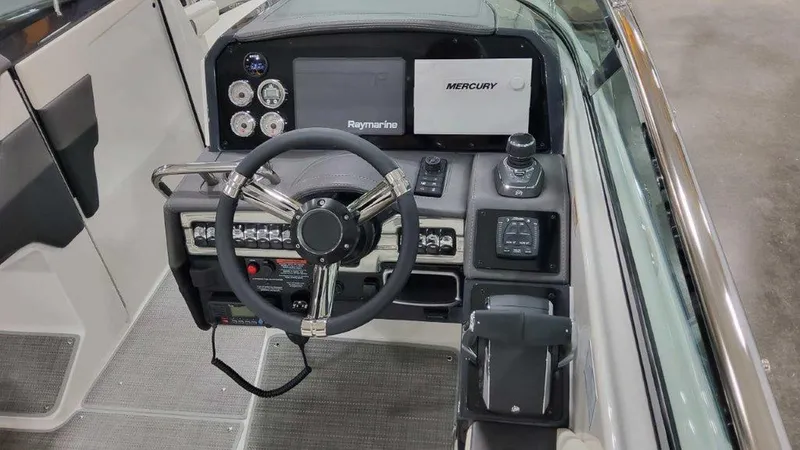 Slide: The Image of 2025 Formula 290 Bowrider dashboard with Raymarine and Mercury displays. - 13