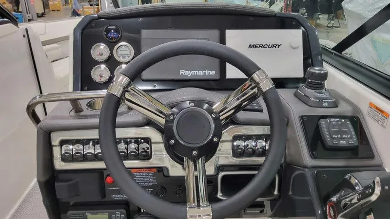 Slide: The Image of 2025 Formula 290 Bowrider dashboard with Raymarine and Mercury controls. - 14