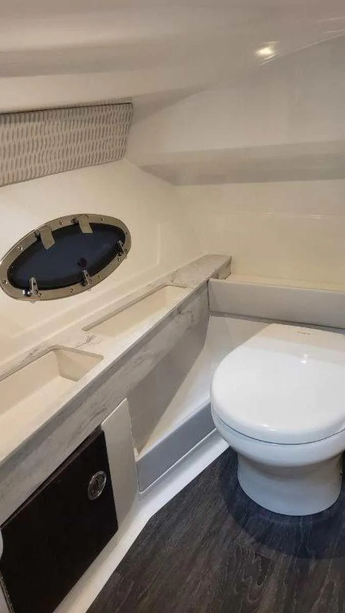 Slide: The Image of 2025 Formula 290 Bowrider boat bathroom with modern design and sleek fixtures. - 16